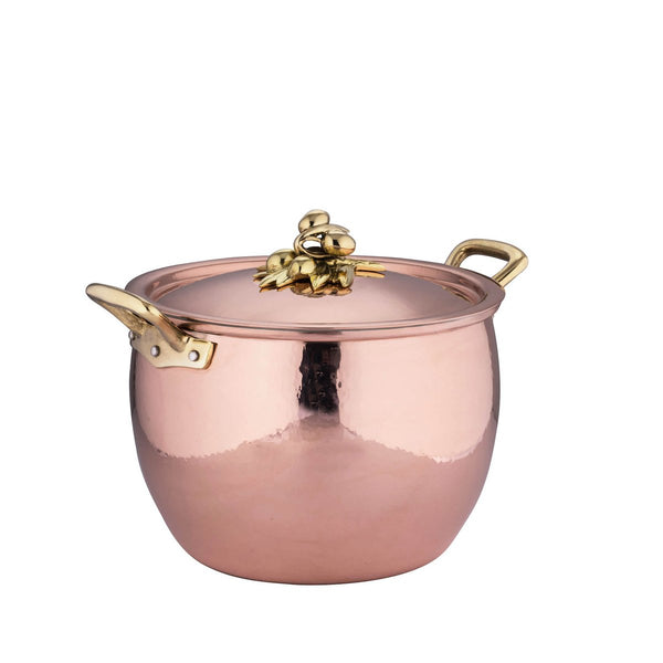 Hand-hammered copper stockpot adorned with olives on the lid