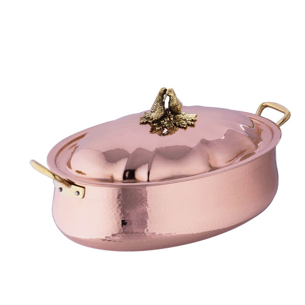 Large copper casserole with domed lid, decorated with two lovebirds on top